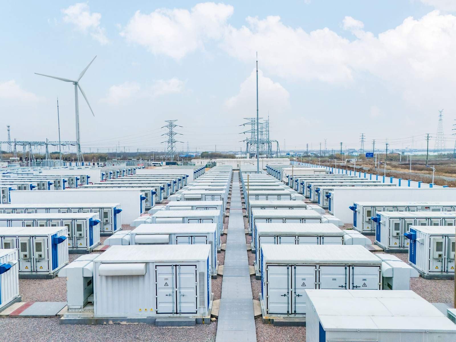 Rows of battery storage containers at a utility-scale battery energy storage facility