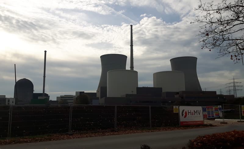 Cooling towers and reactor containment buildings at a nuclear power plant