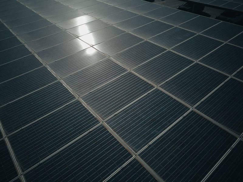 Close-up of solar panel cells reflecting sunlight