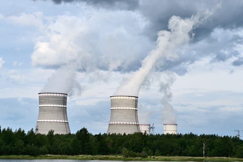 Cooling towers of a nuclear power station releasing vapour into the sky.