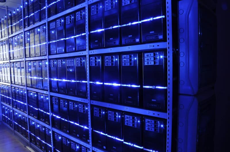Interior of a data center server hall with rows of server racks