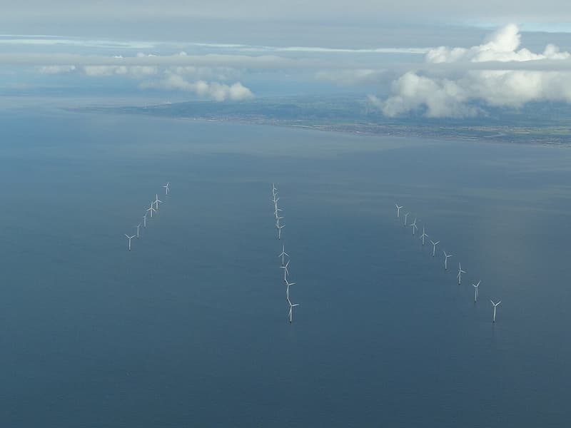 Aerial view of an offshore wind farm in the sea