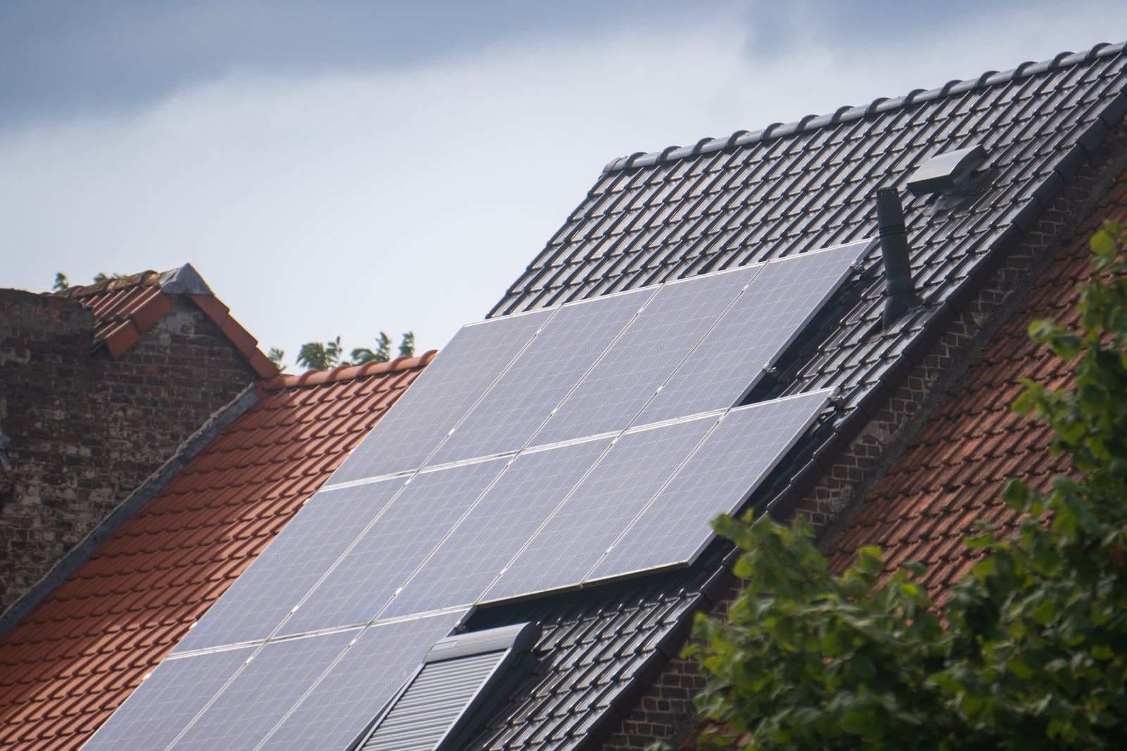 Solar panels installed on a residential rooftop in bright daylight