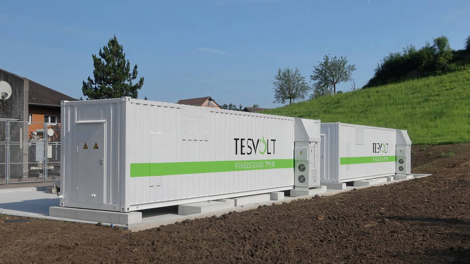 Battery energy storage containers at a grid-scale storage site (illustrative photo)