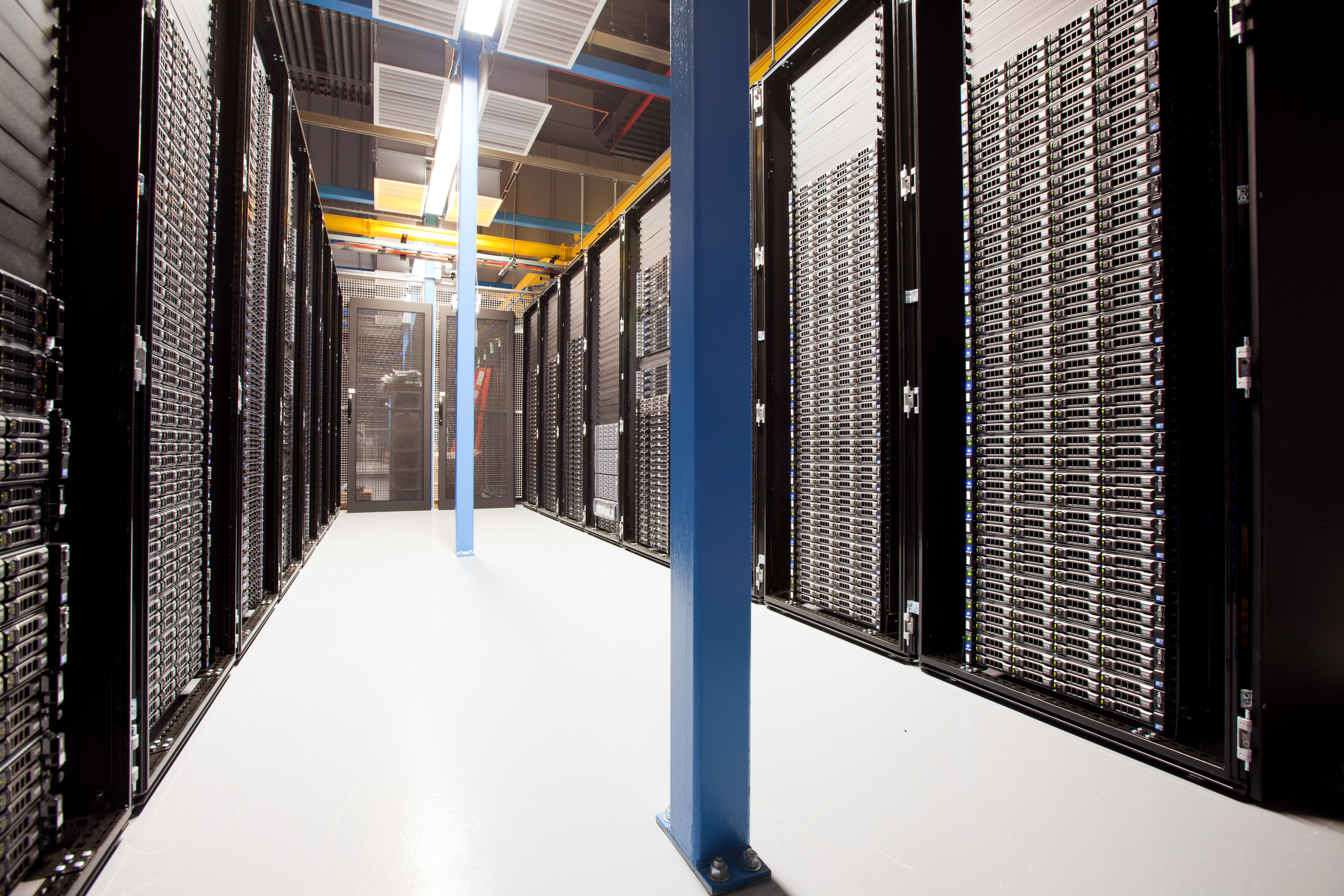 Rows of server racks inside a data center (illustrative image)