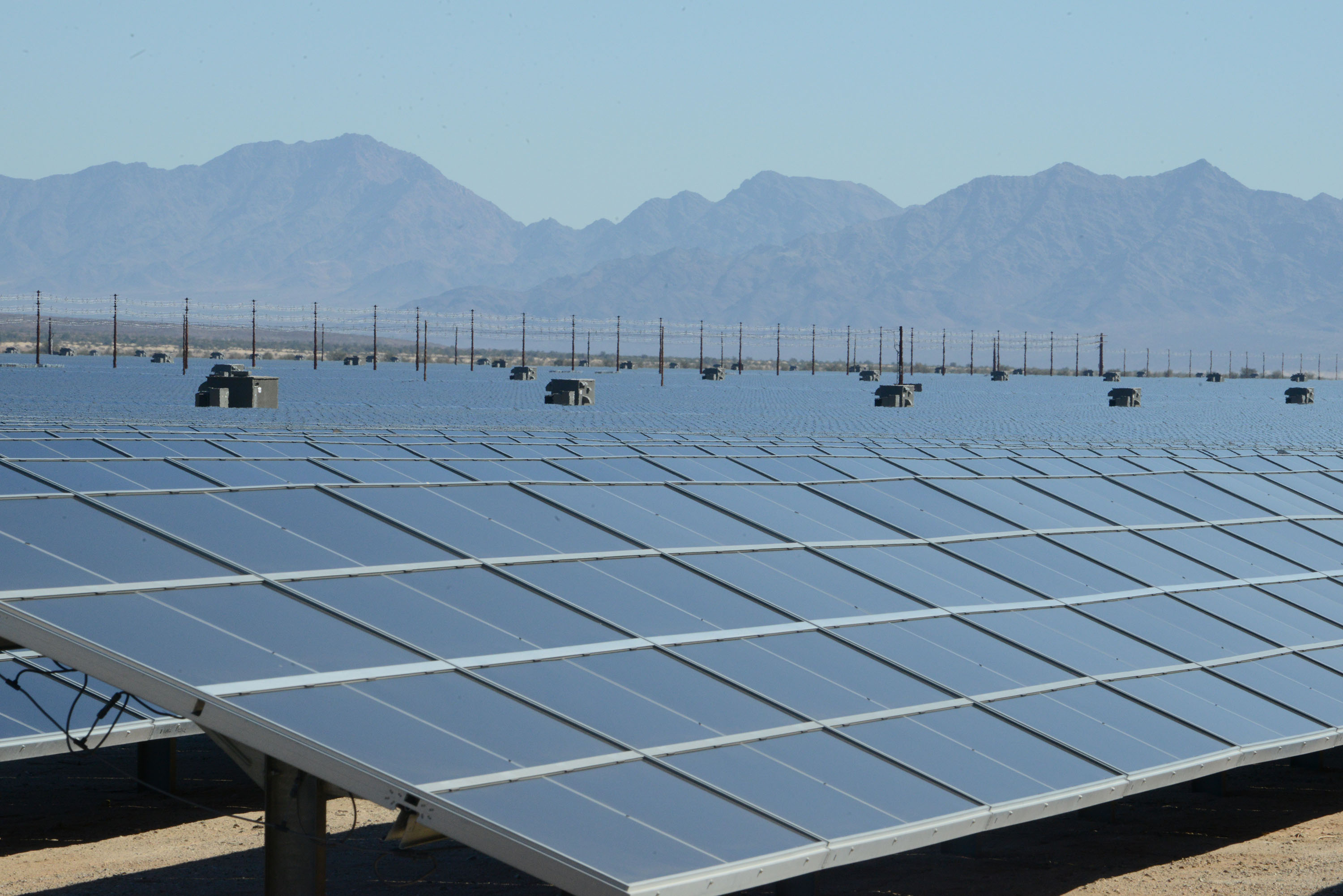 Rows of solar panels at the Desert Sunlight Solar Farm in California's Mojave Desert (illustrative image; not the Three W Solar project)
