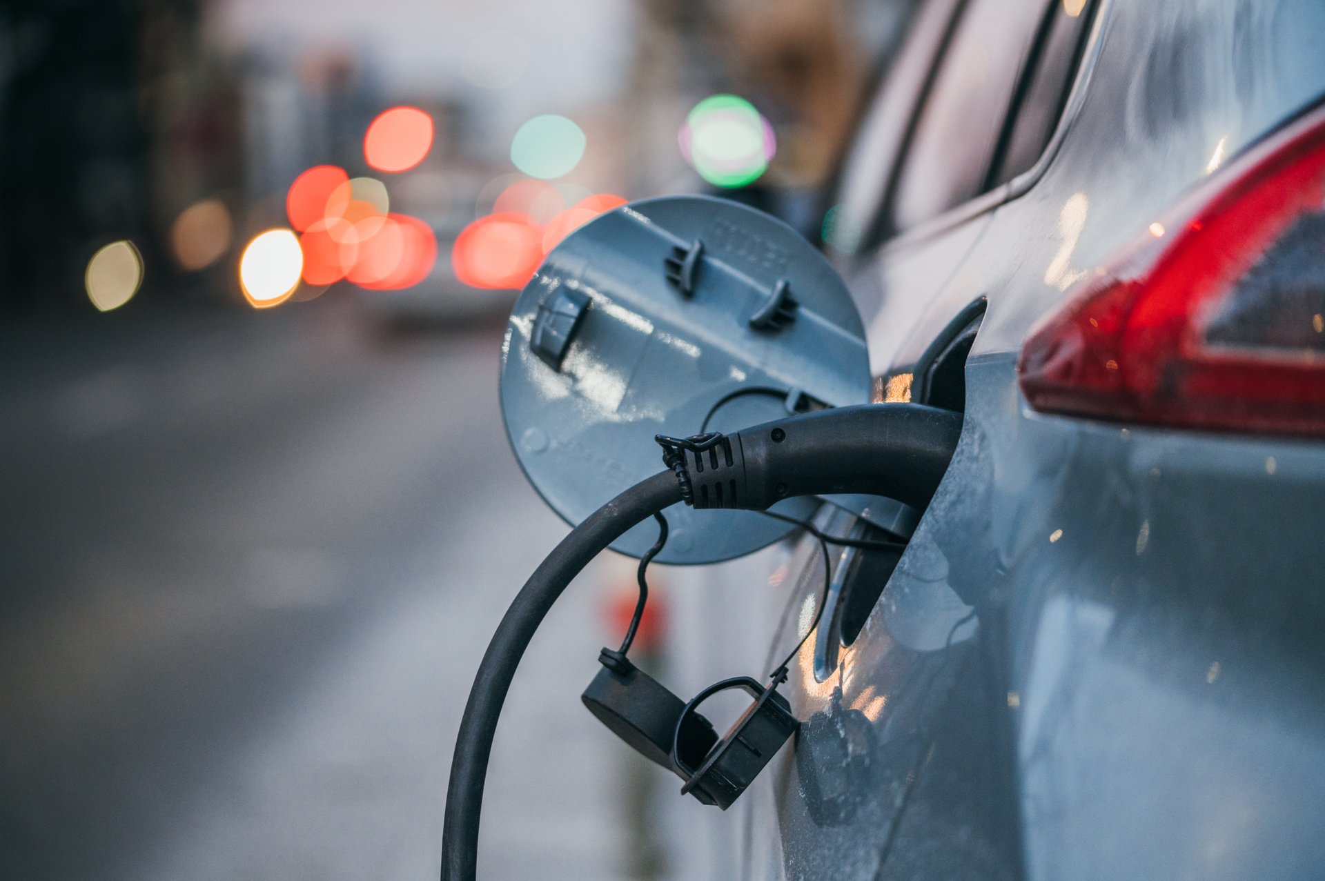 An electric car plugged into a charging point (illustrative photo)