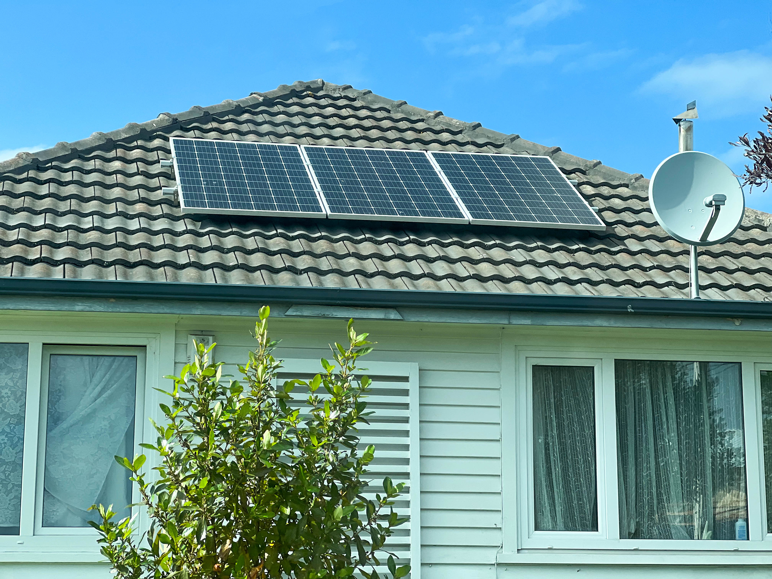 Rooftop solar panels being installed on a home in New Zealand (illustrative photo)